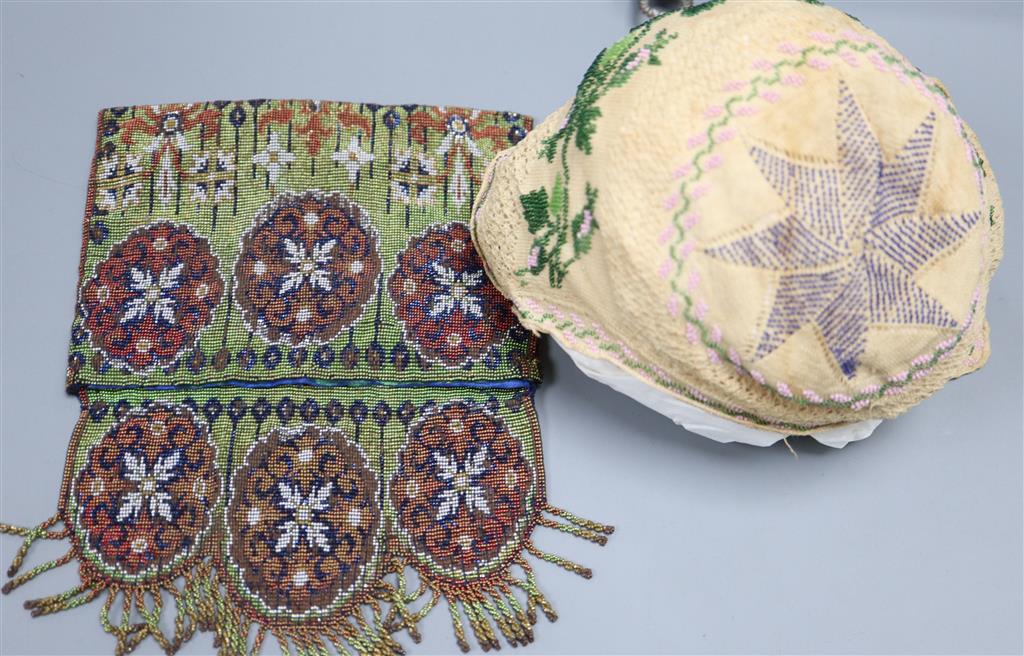 An early 20th century beadwork purse and an unmounted baby bonnet